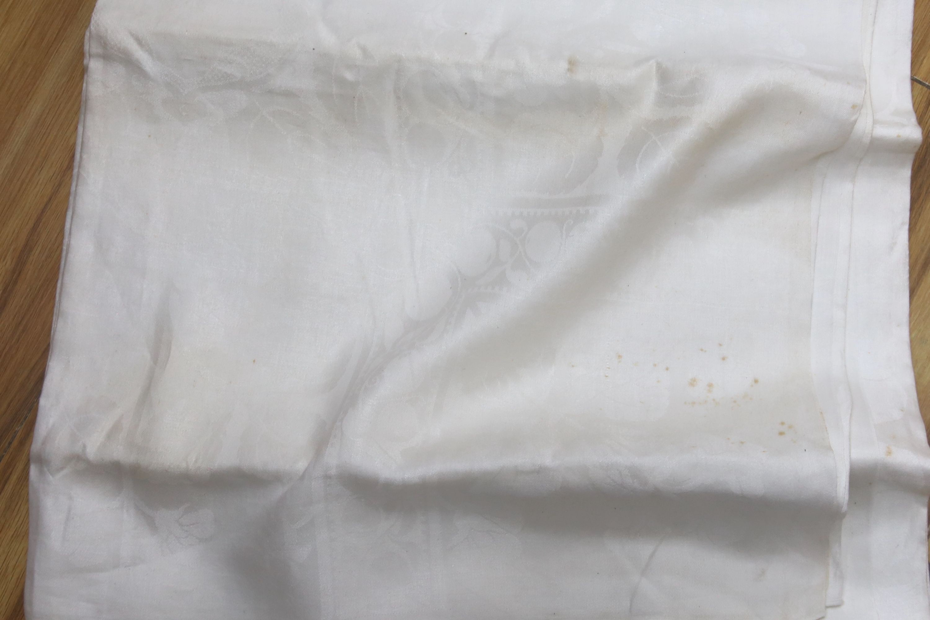 A collection of damask table linen,some with matching napkin sets